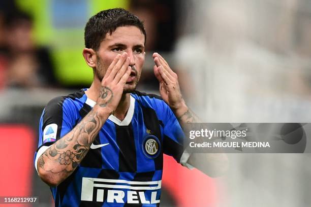 Inter Milan's Italian midfielder Stefano Sensi celebrates after opening the scoring during the Italian Serie A football match Inter Milan vs Udinese...