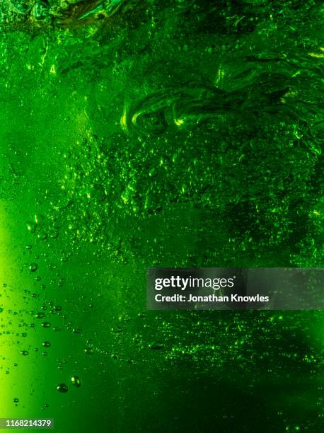 green beer bubbles - bubble stock pictures, royalty-free photos & images