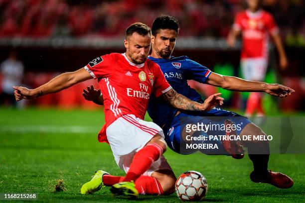 Benfica's Swiss forward Haris Seferovic vies with Gil Vicente's Brazilian defender Rodrigao during the Portuguese League football match between SL...