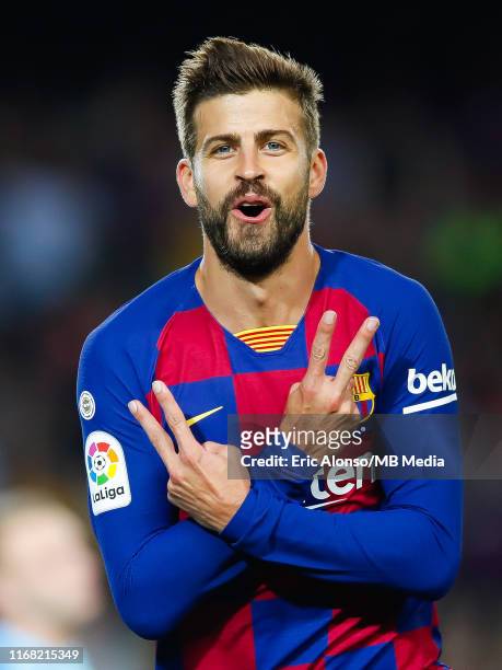 Gerard Pique of FC Barcelona celebrates scoring his side's 3rd goal during the Liga match between FC Barcelona and Valencia CF at Camp Nou on...
