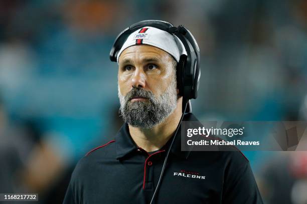 Linebackers coach Jeff Ulbrich of the Atlanta Falcons looks on against the Miami Dolphins during the preseason game at Hard Rock Stadium on August...