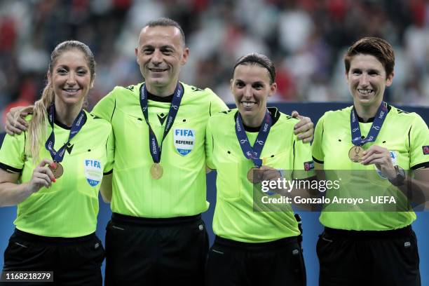 Assistant referee Manuela Nicolosi, 4th referee Cuneyt Cakır, referee Stephanie Frappart and assistant referee Michelle O´Neill pose for a picture...