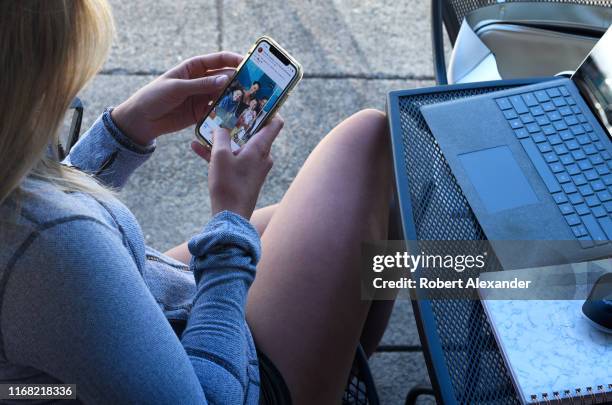 Woman uses her smartphone in Jacksonville, Oregon.