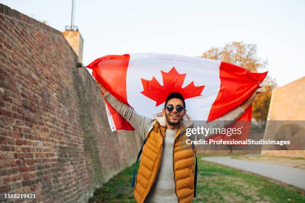 patriotism - canadian flag stock pictures, royalty-free photos & images