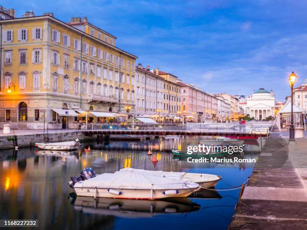 the grand canal, trieste, in the evening. sunset sky with boats and historical buildings. trieste, friuli-venezia giulia region, italy, europe. - triest stock-fotos und bilder
