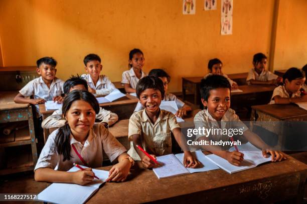 cambodian school children during class, tonle sap, cambodia - cambodian ethnicity stock pictures, royalty-free photos & images