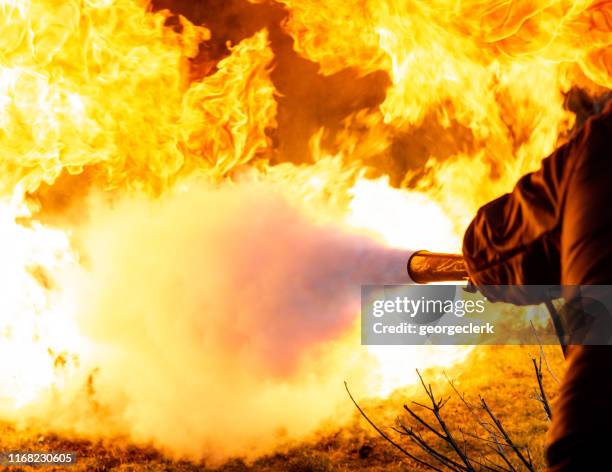 using a carbon dioxide fire extinguisher - fireman uk stock pictures, royalty-free photos & images