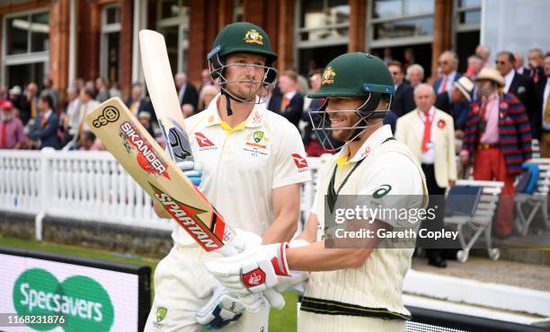 Australia opening batsmen Cameron Bancroft and David Warner head on to the field during day two of the 2nd Specsavers Ashes Test match at Lord's...