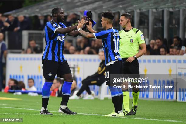 Lautaro Martinez of FC Internazionale greets teammate Romelu Lukaku as he substitutes him during the Serie A match between FC Internazionale and...