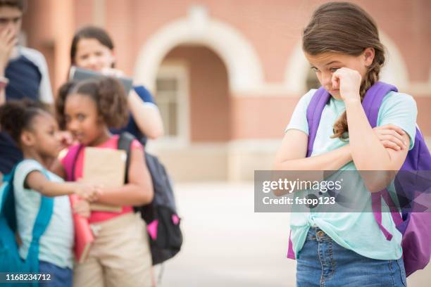 elementary age girl being bullied at school. - teasing stock pictures, royalty-free photos & images