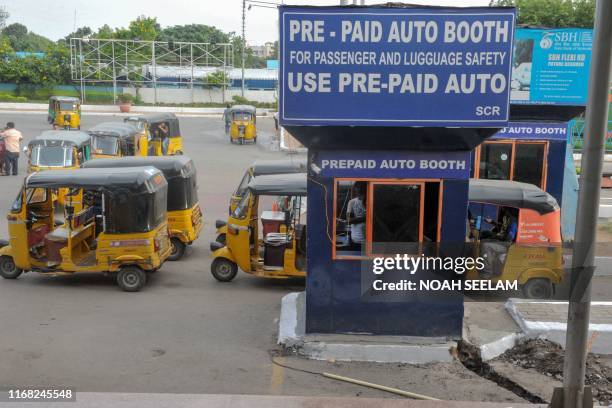 In this photograph taken on September 11 three-wheeler auto-rickshaws are parked at a prepaid area near a railway station in Hyderabad. - When...