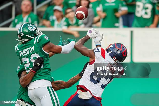 Loucheiz Purifoy of the Saskatchewan Roughriders breaks up a pass intended for Eugene Lewis of the Montreal Alouettes in the game between the...