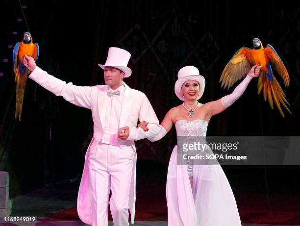 Artists perform with parrots during the presentation of the new fantasy steampunk circus show 'Pendulum of Time' at the Ukrainian National Circus in...