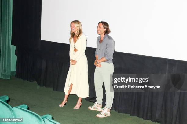 Gwyneth Paltrow and Brad Falchuk speak in the theater at a promotional party for Netflix's "The Politician" at a private home on August 2, 2019 in...