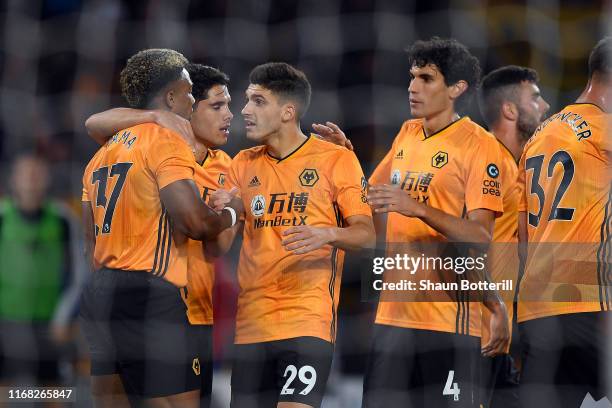 Ruben Vinagre celebrates with Adama Traore of Wolverhampton Wanderers after scoring during the UEFA Europa League Third Qualifying Round Second Leg...