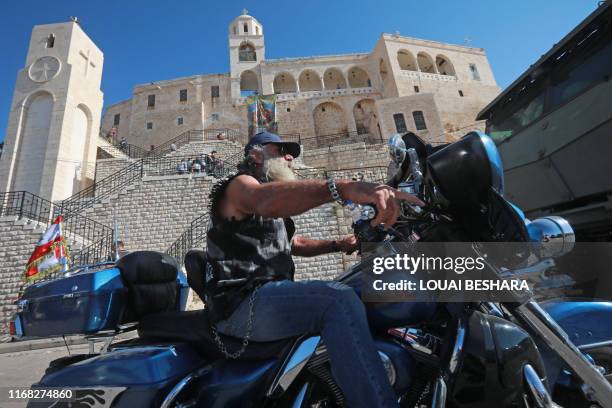 Motorcyclist from Lebanon takes part in a ride through the town of Saidnaya, north of Syria's capital Damascus, on September 14, 2019.