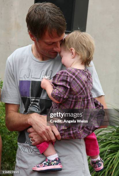Pro Skateboarder Tony Hawk and his daughter Kadence Clover Hawk arrive to the 'Tony Hawk: Ride Presents Stand Up For Skateparks' Benefit held at the...