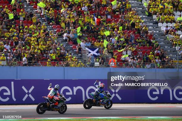 Trentino Gresini MotoE, Italian rider Matteo Ferrari , followed by Ongetta SIC58 Squadracorse, Italian rider Mattia Casadei, celebrates after winning...