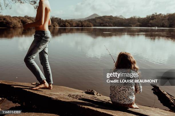 sitting and fishing in the sun - brunswick heads nsw stock pictures, royalty-free photos & images