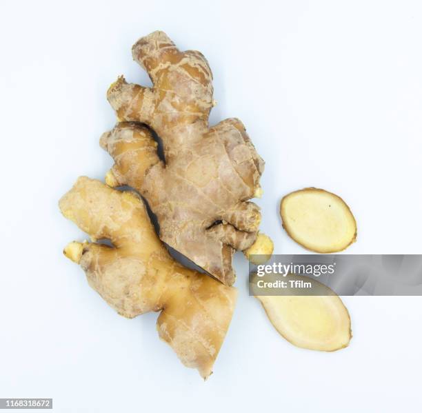 fresh ginger on white background - ginger stock-fotos und bilder