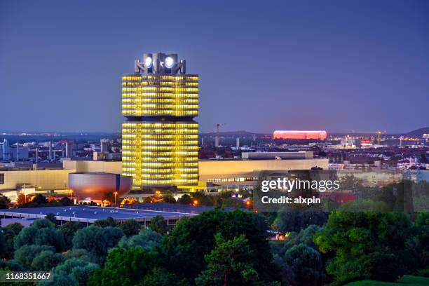 bmw headquarters and allianz arena in munich - bmw münchen stock pictures, royalty-free photos & images