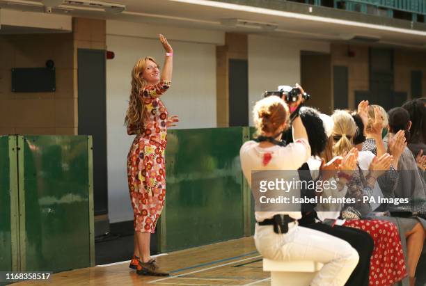 Designer Molly Goddard acknowledges the audience following the Spring/Summer 2020 London Fashion Week show at Seymour Hall, London.