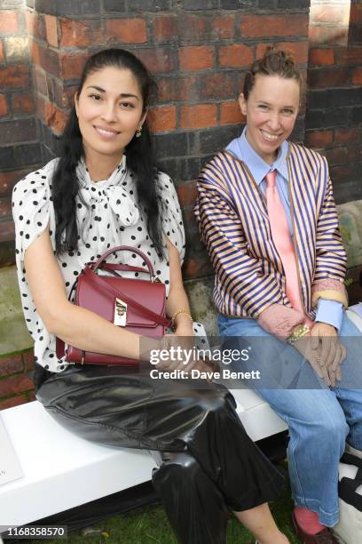 Caroline Issa and Lady Frances von Hofmannsthal attend the Roland Mouret front row during London Fashion Week September 2019 at The Royal Academy of...