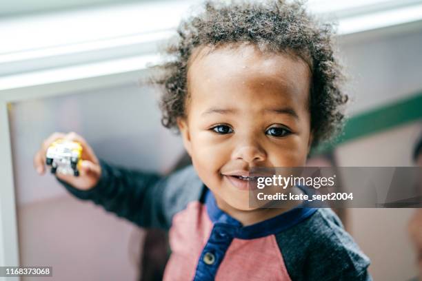 the power of optimism - african baby stock pictures, royalty-free photos & images