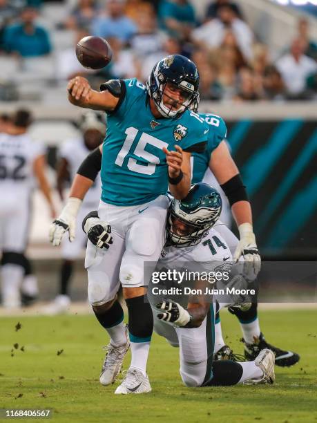 Defensive End Daeshon Hall of the Philadelphia Eagles forces a fumble by Quarterback Gardner Minshew II of the Jacksonville Jaguars during the game...