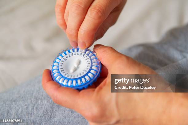 hrt pill for mature woman at menopause - hormone stock pictures, royalty-free photos & images