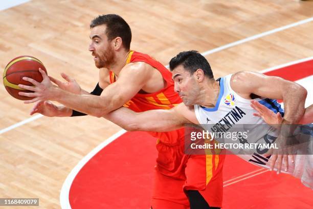 Argentina's Luis Scola fights for the ball with Spain's Victor Claver during the Basketball World Cup final game between Argentina and Spain in...
