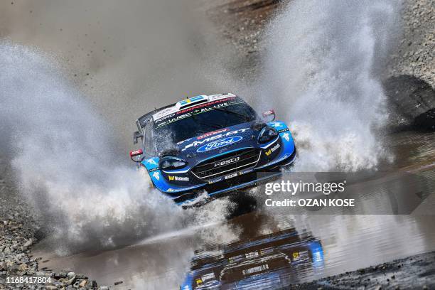 Sweden's driver Pontus Tidemand and Norway's co-driver Ola Floene steer their Ford Fiesta WRC car during the final day of the 2019 FIA World Rally...