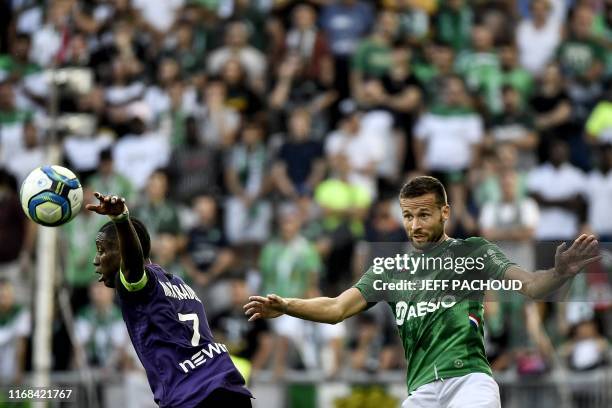 Saint-Etienne's French midfielder Yohan Cabaye vies with Toulouse's French forward Max Alain Gradel during the French L1 football match between AS...