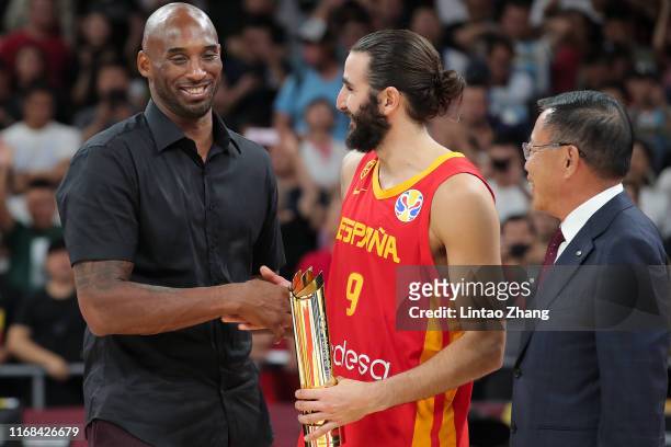Ricky Rubio of Team Spain is awarded the FIBA World Cup tournament MVP with NBA Legends Kobe Bryant during FIBA World Cup 2019 final match between...