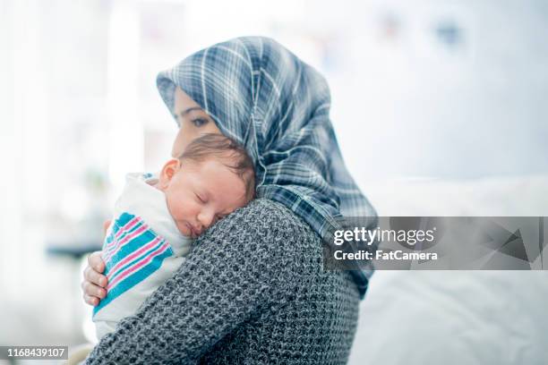 muslim mother and baby - islamic stock pictures, royalty-free photos & images