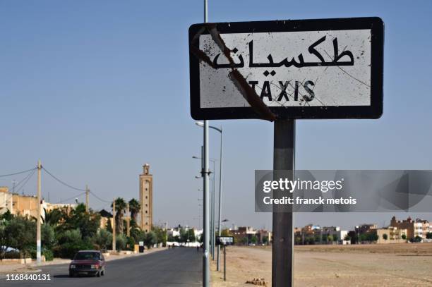 road sign indicating the taxi stand ( morocco) - oujda stock pictures, royalty-free photos & images