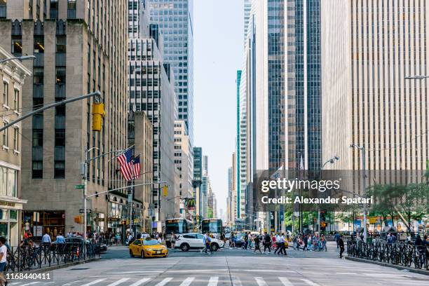 skyscrapers along 6th avenue in new york city, usa - ミッドタウン ストックフォトと画像