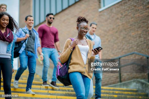 new students on a college campus - community college campus stock pictures, royalty-free photos & images