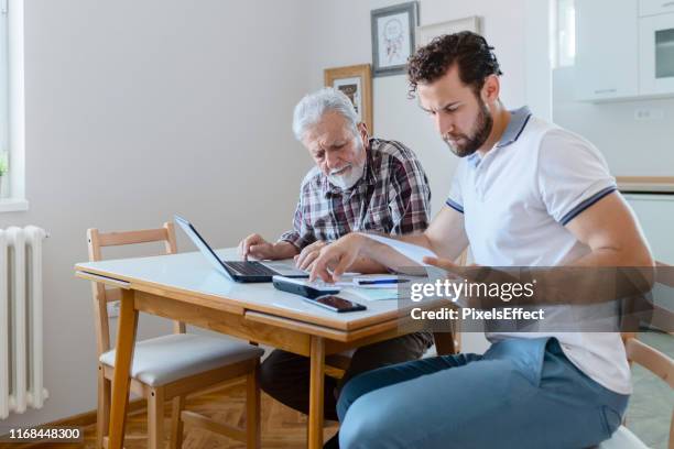 family budget - hipster senior man stock pictures, royalty-free photos & images