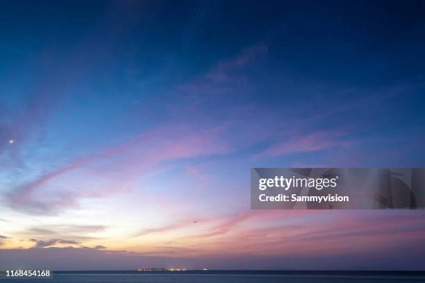 dramatic sky during sunset - schemer stockfoto's en -beelden