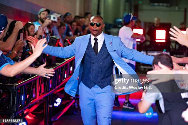 Eddie George of the Tennessee Titans walks through fans before a game against the Indianapolis Colts at Nissan Stadium on September 15, 2019 in...