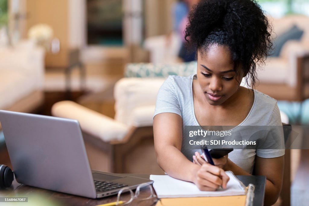 Female college student work on homework