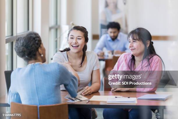 college student meets with loan officer - credit union stock pictures, royalty-free photos & images