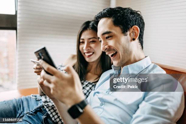 couple working together online - hearing aids stock pictures, royalty-free photos & images
