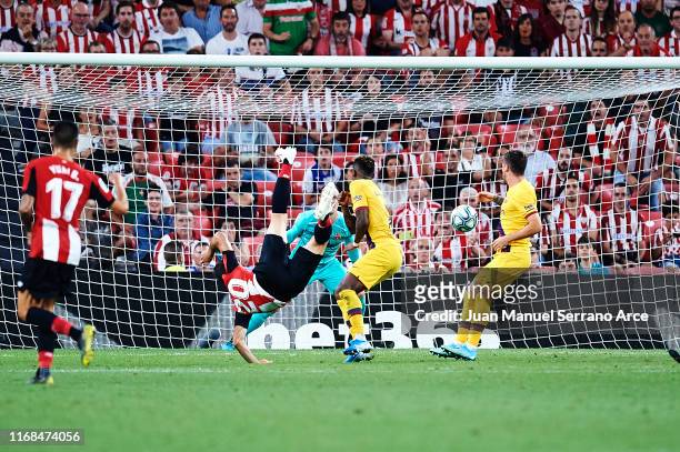 Aritz Aduriz of Athletic Club shoots for score the first goal of Athletic Club during the Liga match between Athletic Club and FC Barcelona at San...