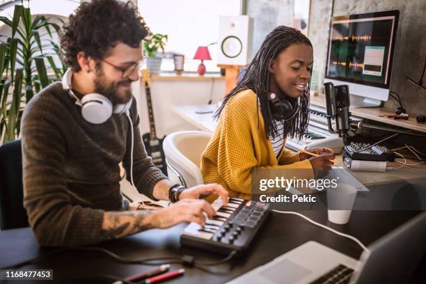 multi-ethnic team of composers working in studio - radio dj stock pictures, royalty-free photos & images