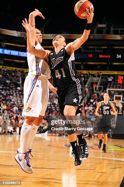 Tully Bevilaqua of the San Antonio Silver Stars shoots against Diana Taurasi of the Phoenix Mercury on June 17, 2011 at U.S. Airways Center in...