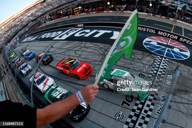 Austin Cindric, driver of the MoneyLion Ford, leads the field to the green flag to start the NASCAR Xfinity Series Food City 300 at Bristol Motor...