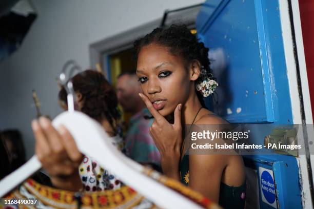 Models backstage during the Ashish Spring/Summer 2020 London Fashion Week show outside the Seymour Hall in London.