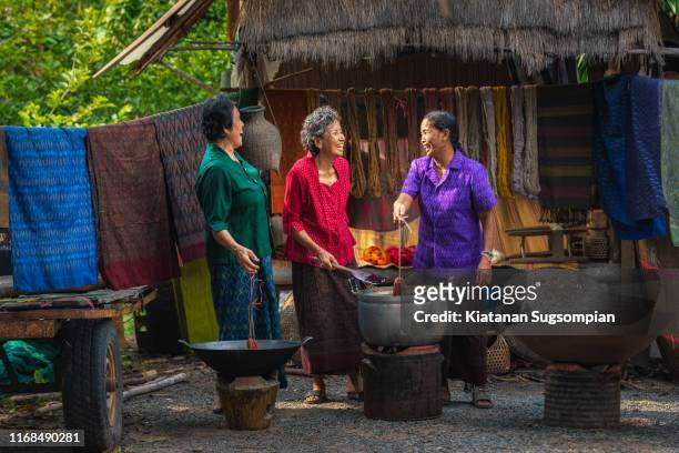 traditional asian silk dyeing - village asia stock-fotos und bilder